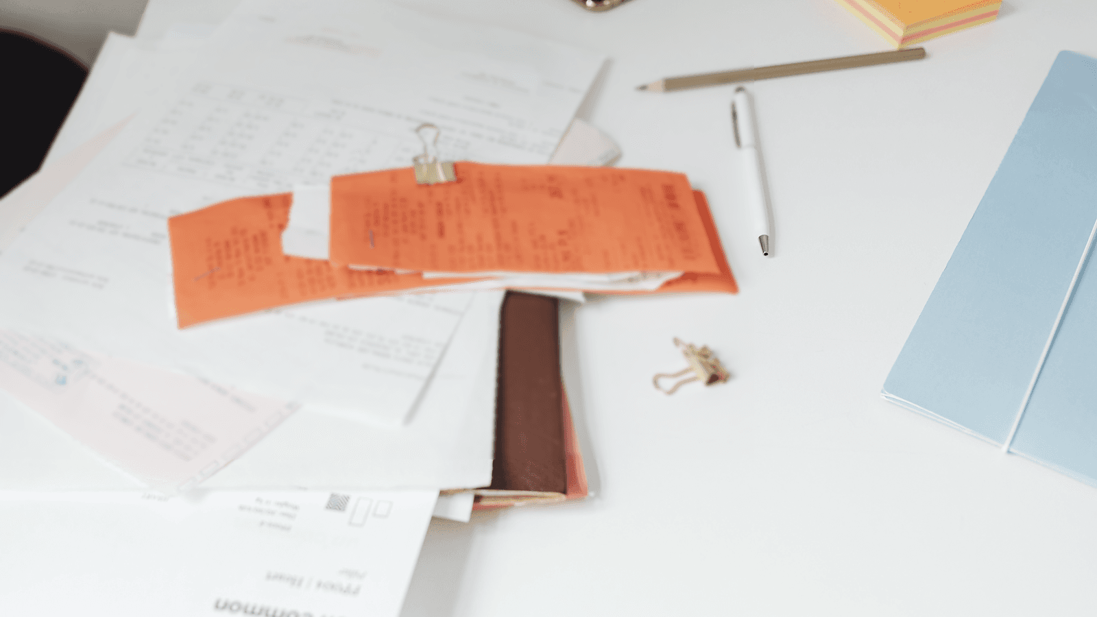 Organised compliance documents arranged neatly on a desk
