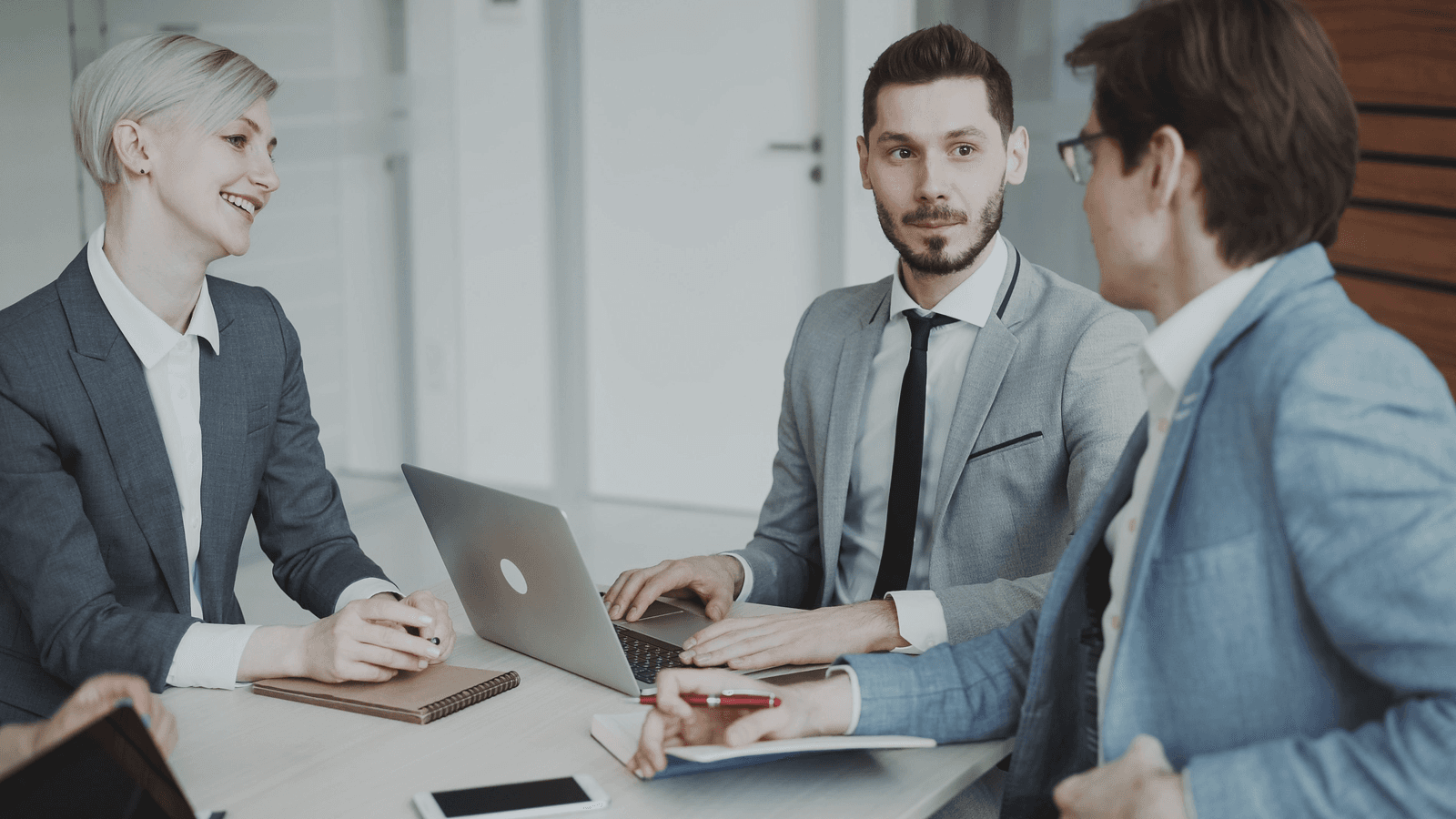 Management strategy discussion at a bright meeting table