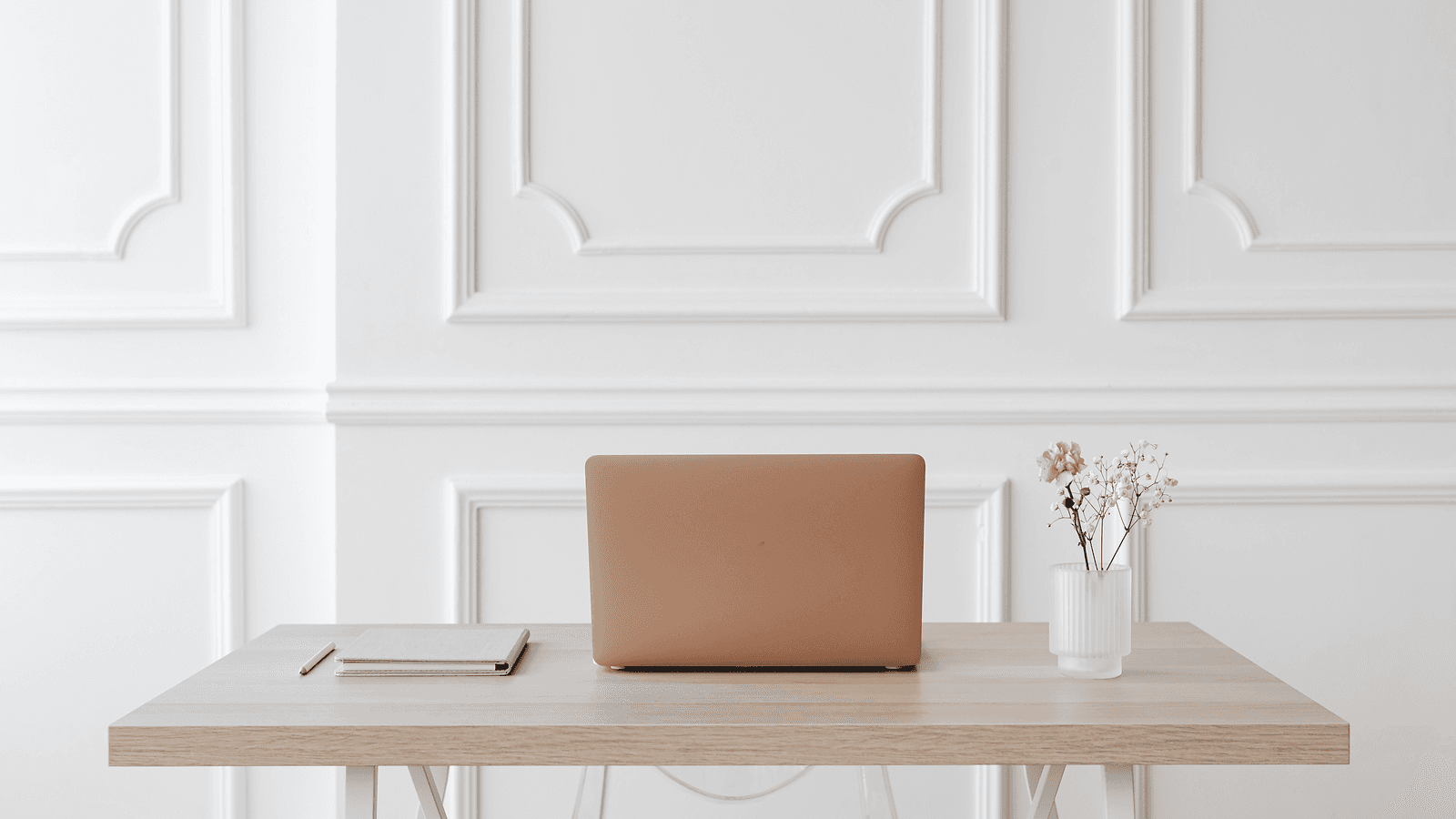 Professional bookkeeping workspace with organised documents and a laptop