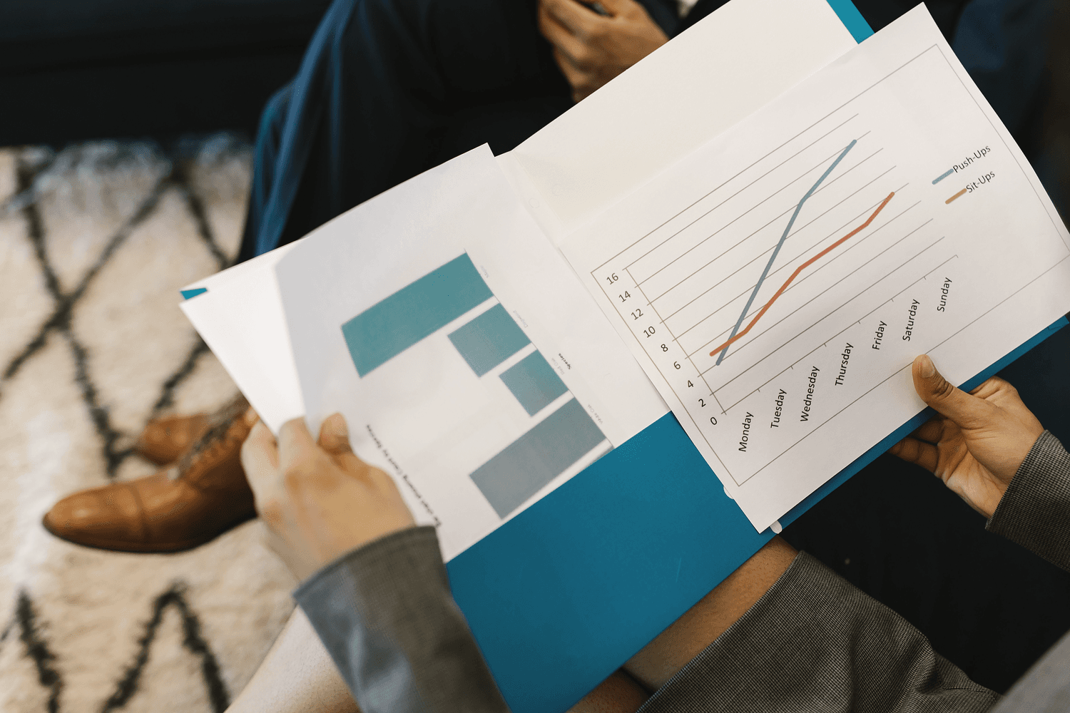 Management reporting discussion at a meeting table